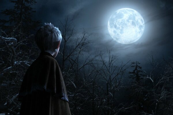 Image d un garçon sur un fond d arbres et de la lune