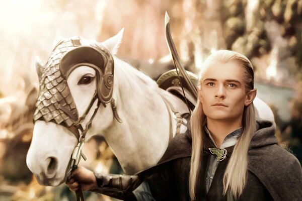 Legolas holds a white horse