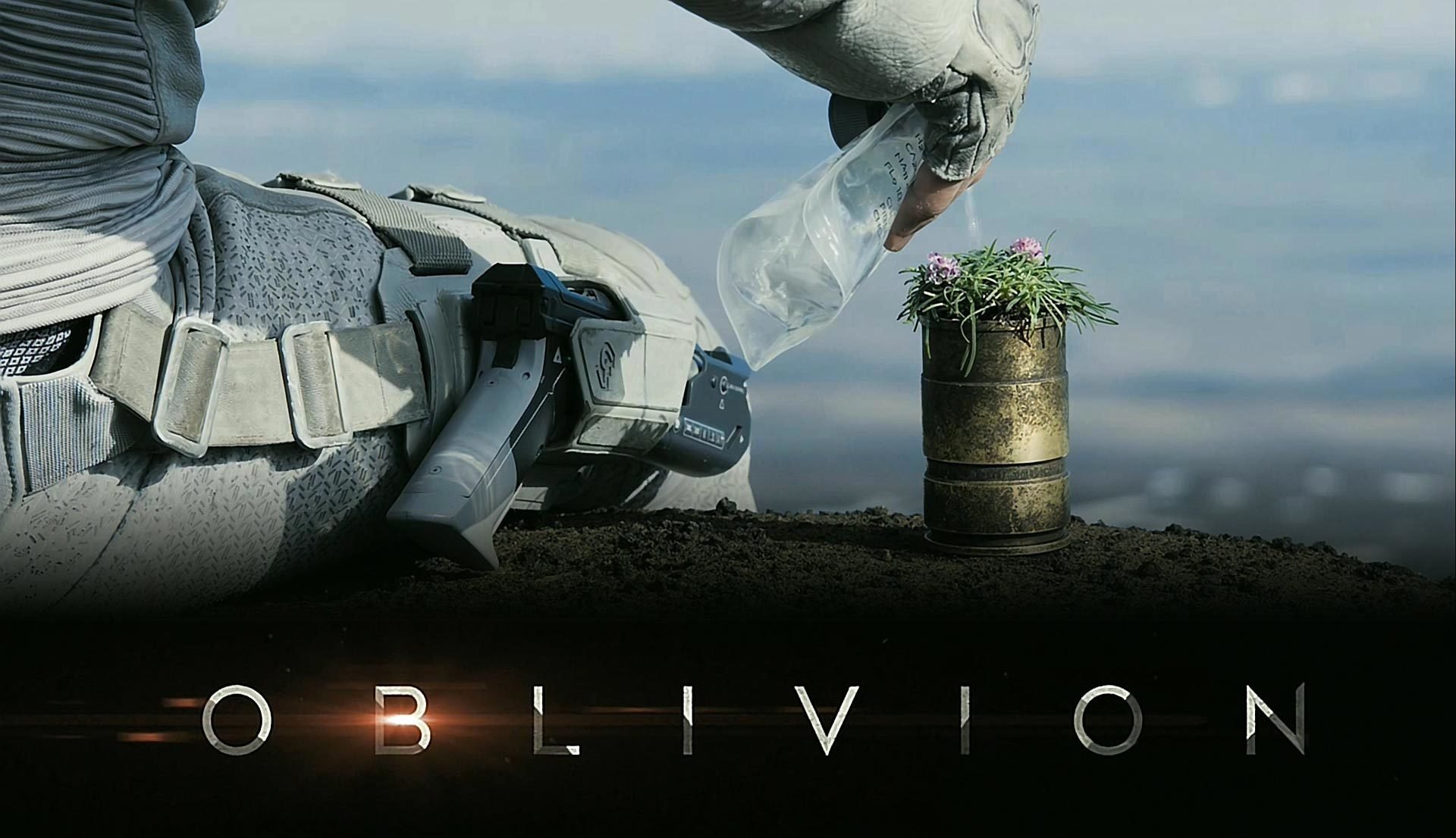 oubli tom cruise oblivion assis terre fleurs eau