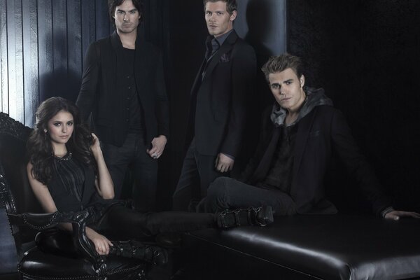 Three men and a girl in black from the movie the Vampire Diaries