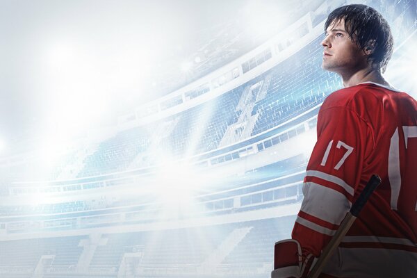 Danila Kozlovsky au stade en uniforme de hockey regarde vers le haut