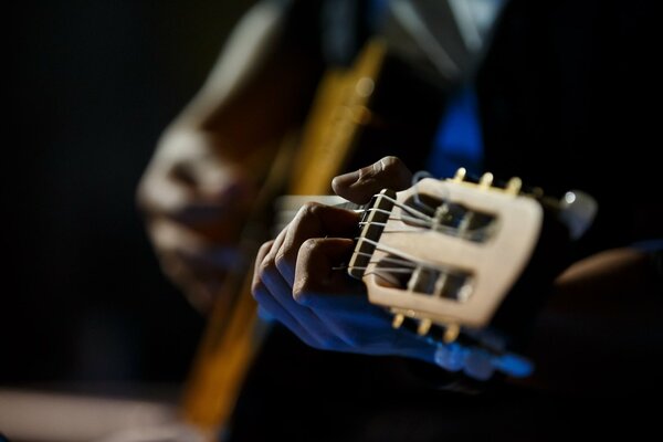 Hands playing the guitar