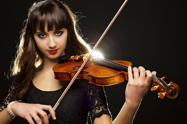 Retrato de una niña tocando el violín