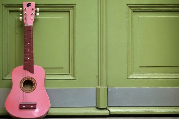 Pink guitar, music, green background