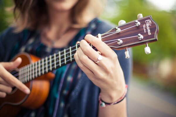 Guitar and fingers close-up