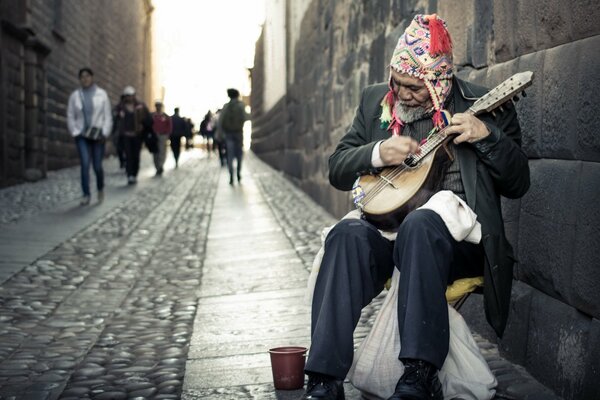 A street musician on a crowded street