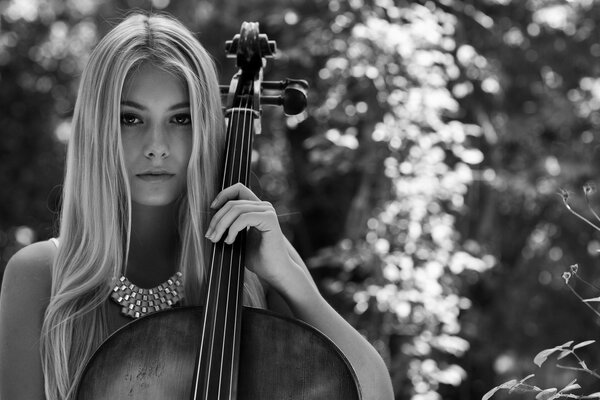 A girl with long hair plays the cello