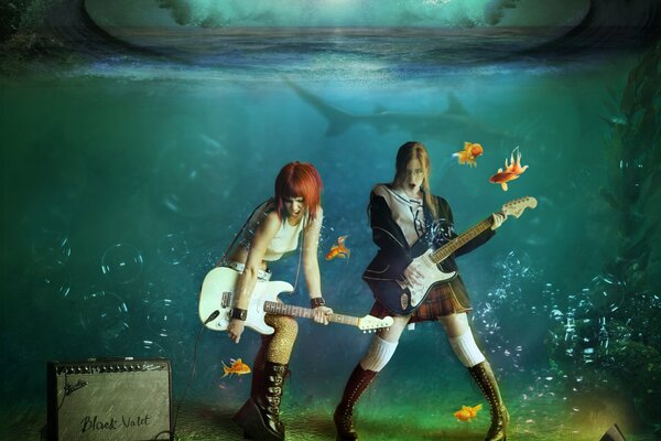 Concerto di ragazze con chitarre sott acqua