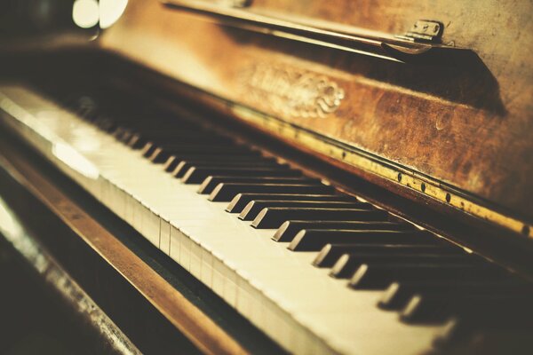 Black and white keys on an old piano