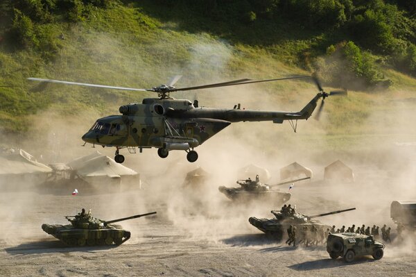 Helicopter and tanks and there is a battle