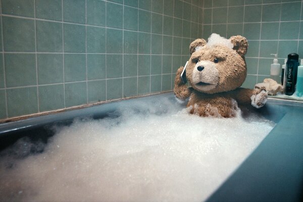 Ted the bear from the movie The Third Extra bathes in a foam bath