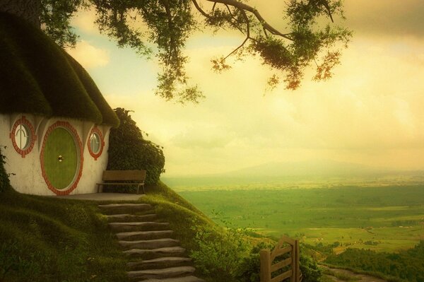 Art of a house among greenery from The Lord of the Rings .