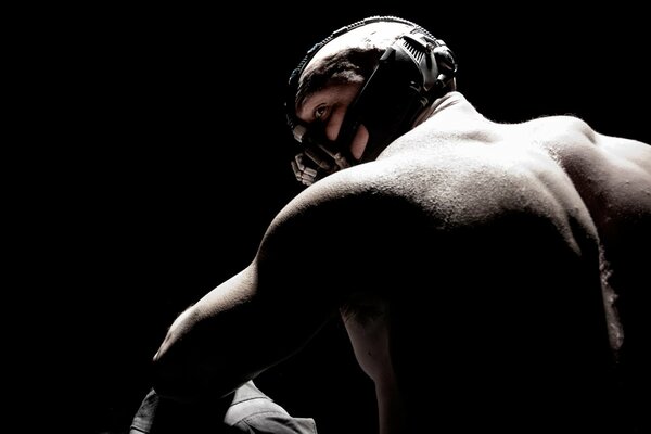 Tom Hardy in a mask on a black background