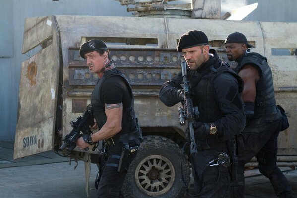 Stallone, Statham with a gun from the movie The Expendables 2