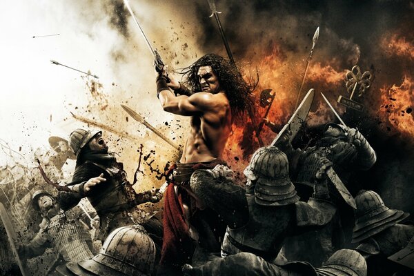 Conan el Bárbaro destruye solo un ejército de enemigos con armadura en la batalla