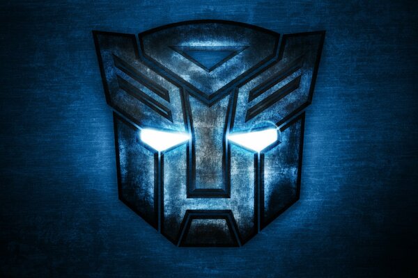 Logo en forme de masque de transformateur Autobot sur fond bleu