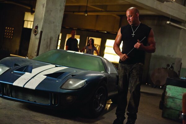 Vin Diesel with a tire iron. A shot from the movie Fast and Furious .