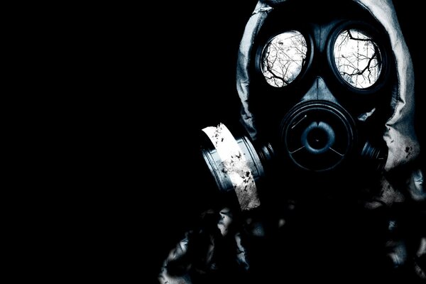 STALKER on a black background in a protective suit and gas mask