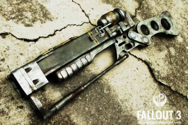 A rifle from a computer game on asphalt