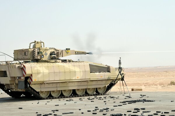 An armed German tank on a vacant lot