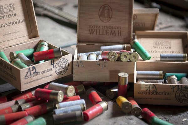 Macro photo of wooden boxes with cartridges