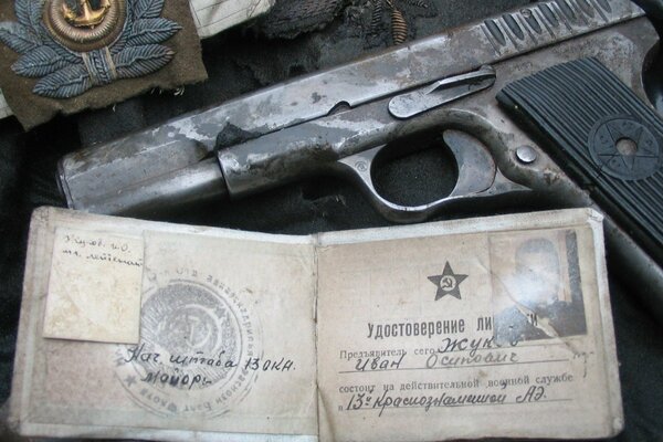 Soviet pilot Zhukov s belongings: a pistol and a certificate