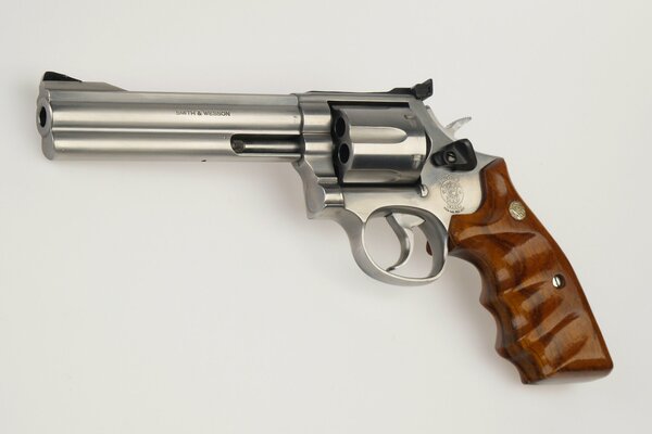 A beautiful revolver with a wooden handle