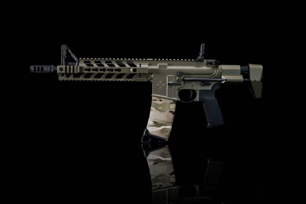 Assault rifle on a black background