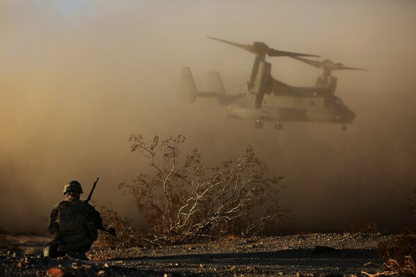 The shooter watches the helicopter landing