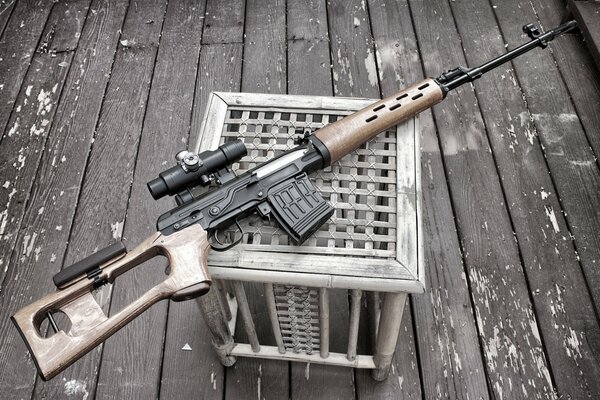 Sniper rifle on a stool