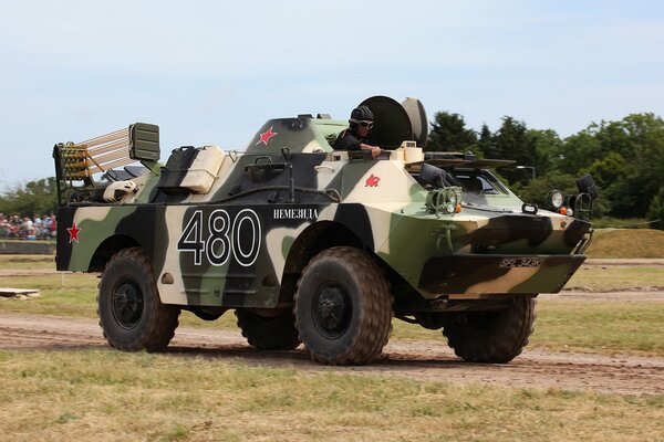 A man in a combat reconnaissance vehicle