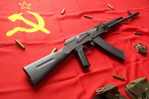 Kalashnikov assault rifle on the flag of the USSR