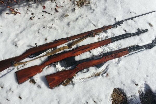 Rifles in the snow. Russian weapons. Brown rifles