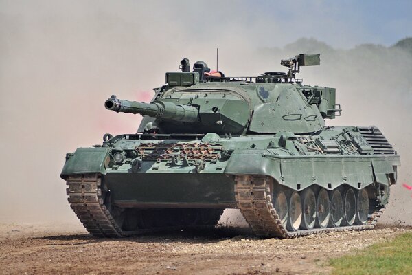 Battle tank on field exercises