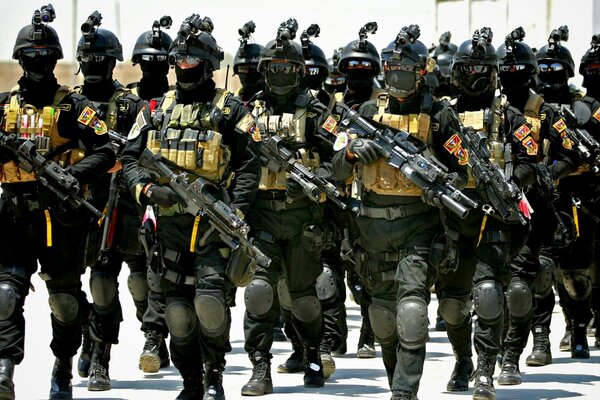 Iranian special forces with weapons are marching in formation