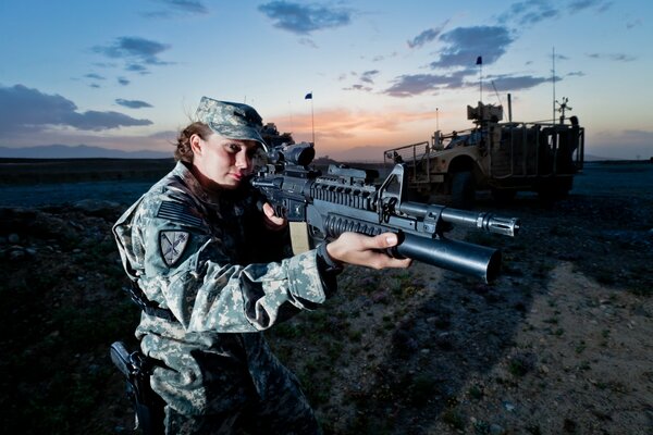 A girl soldier with a machine gun in her hands