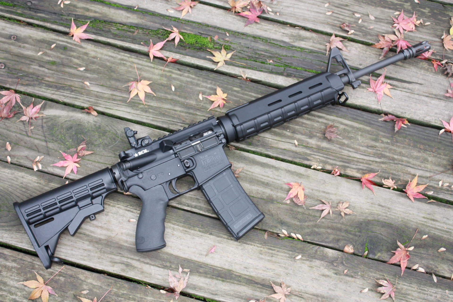 ar-15 rifle assault wood floor moss leave