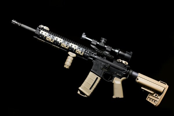 Assault rifle on a black background