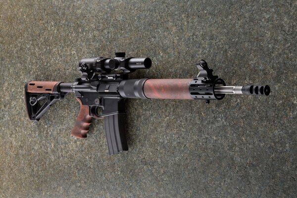 The AR-15 assault rifle is lying on the ground