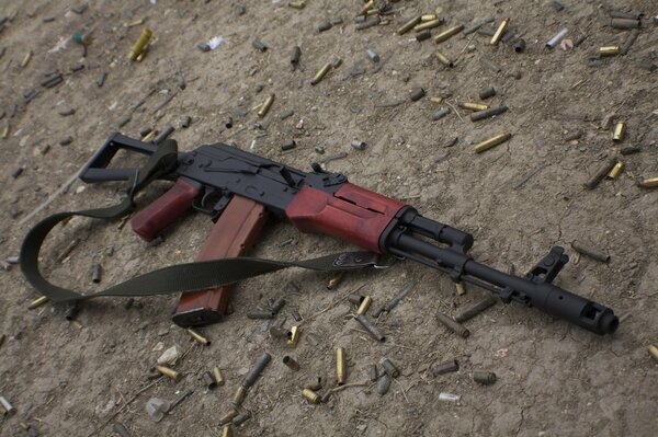 Kalashnikov assault rifle with cartridges on the ground