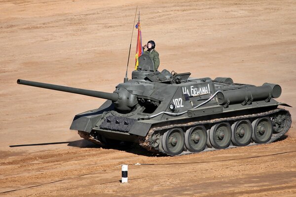 The tank is on the road. A soldier on a tank