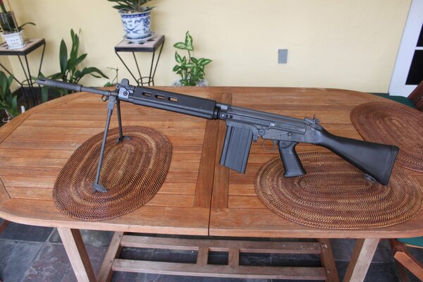 Photo of an automatic rifle on the table