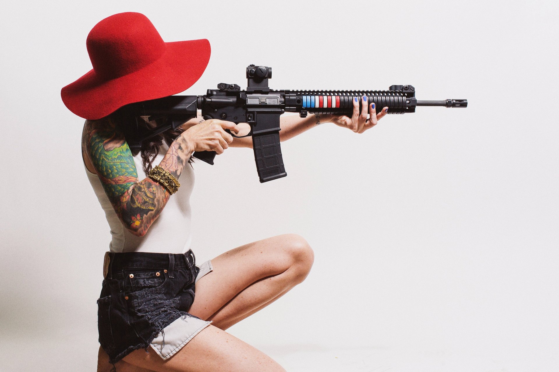 girl hat hair tattoo assault rifle