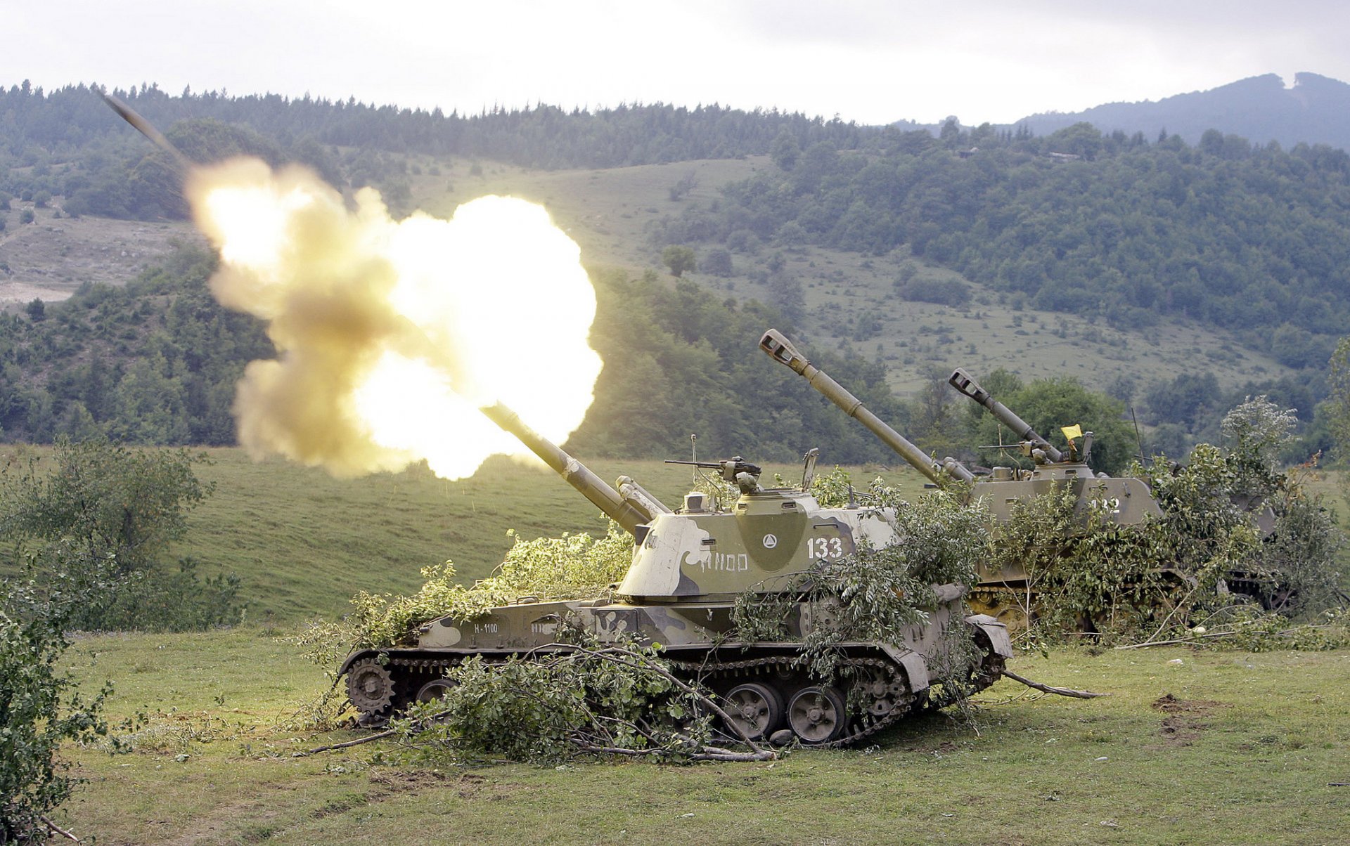 acs 2s3 self-propelled howitzers fire the field