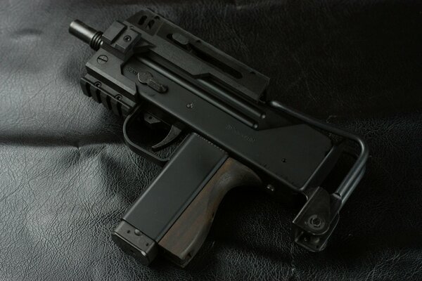 Leather, shades of black, yes, this is a mas-11 submachine gun