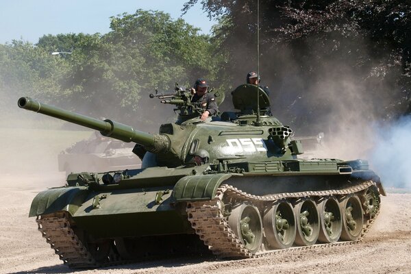 Two tankmen with weapons on the tank