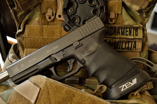 Glock 20 self-loading pistol in uniform