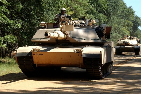 A column of army tanks on the road