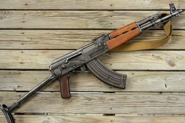 AK-47 assault rifle on a wooden background