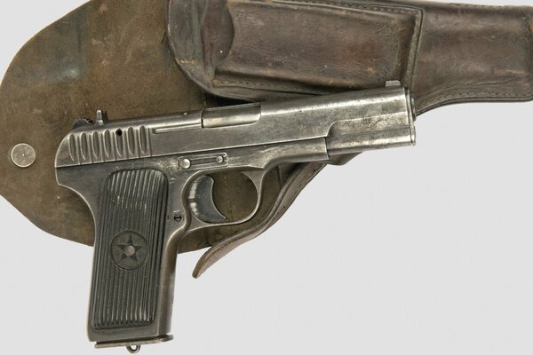 Tokarev 33 pistol lying on the holster